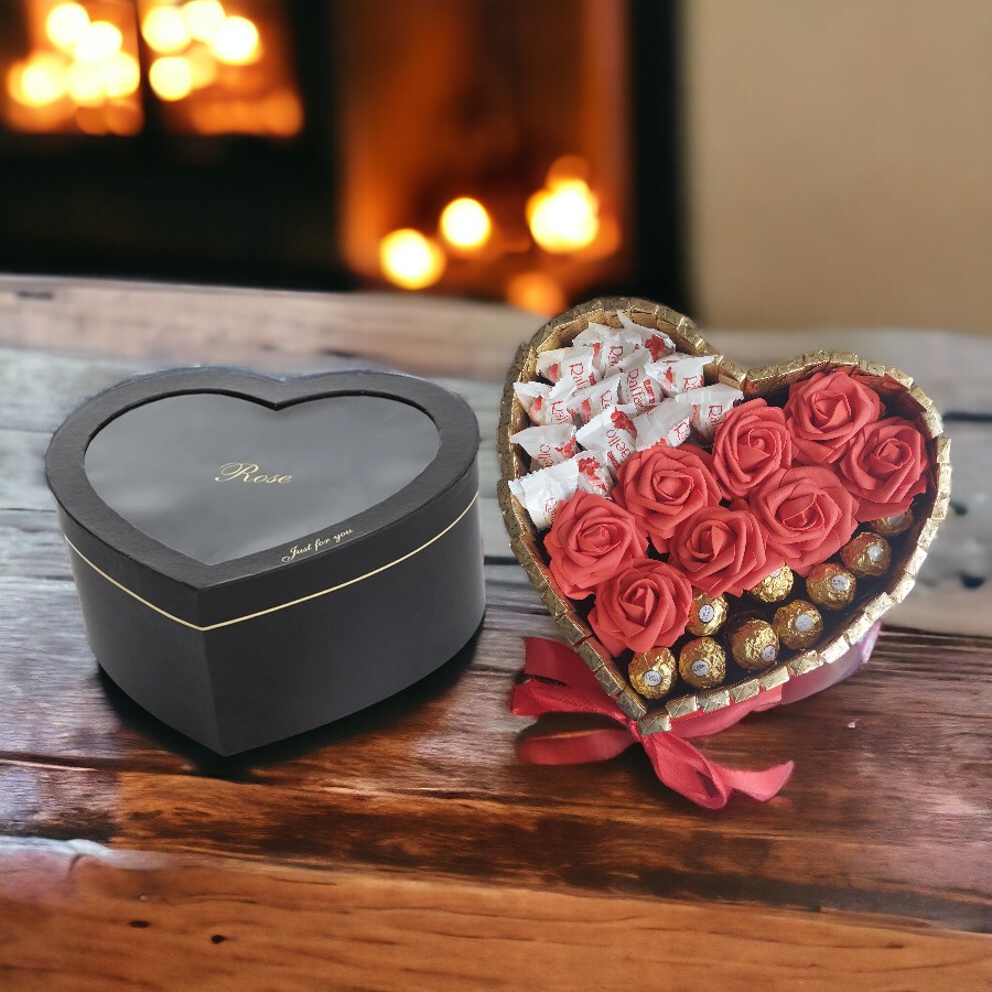 Ferrero Rocher Hart met Zwart Hartvormige Geschenkdoos op een houten tafel